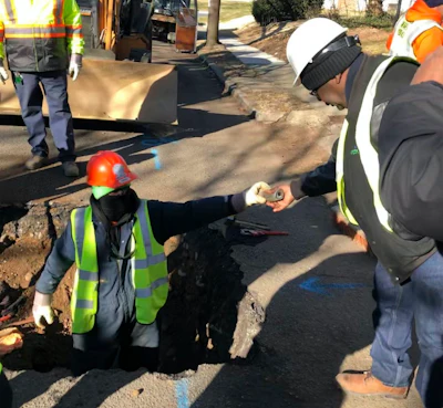 Workers remove water service lines in Trenton, New Jersey, on Jan. 9, 2020. The city is replacing 37,000 lead pipes over five years.