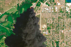 In this Satellite image provided by Planet Labs Inc., a huge plume of smoke and fires can be seen at the Chemtool Inc. plant near Rockton, IL on June 14.