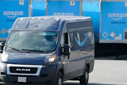 In this Oct. 1, 2020, file photo, an Amazon delivery van departs an Amazon Warehouse in Dedham, Mass. The Teamsters, a union that represents 1.4 million delivery workers, is setting its sights on Amazon. The union is voting Thursday, June 24, 2021, on whether to make organizing Amazon workers its main priority, saying that Amazon, which is now the nation’s second-largest private employer, is exploiting its employees by paying them low wages, pushing them to work at fast speeds and offering no job security.