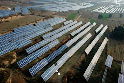 In this Nov. 28, 2019, file photo, a solar panel installation is seen in Ruicheng County in central China's Shanxi Province. China's government on Friday, June 25, 2021 criticized U.S. curbs on imports of solar panel materials that might be made with forced labor as an attack on its development and said Beijing will protect Chinese companies, but gave no details of possible retaliation.