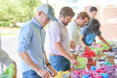 AD associates assembling boxes filled with toys, coloring books and other activities at one of the buying group's Giving Back event locations on June 16.
