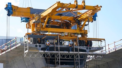 A construction crew work on a new segment of the I-395 interstate highway on May 6 in Miami.