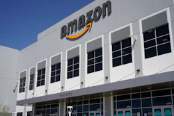 A worker walks out of an Amazon Fulfillment Center, Wednesday, March 31, 2021, in North Las Vegas. Amazon said it will stop testing its workers for COVID-19 at its warehouses at the end of July, citing the availability of vaccines and free testing.