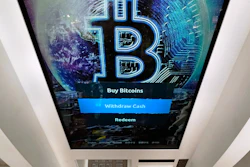 Bitcoin logo on a cryptocurrency ATM at the Smoker's Choice store, Salem, N.H., Feb. 9, 2021.
