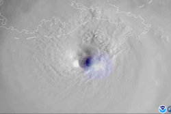 This satellite image provided by the National Oceanic and Atmospheric Administration and captured by NOAA's GOES-16 shows lightning swirling around the eye of Hurricane Ida as the storm approaches the Louisiana coast on the morning of Aug. 29.