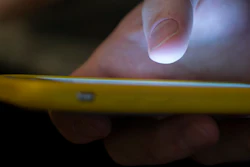 A man uses a cellphone in New Orleans, Aug. 11, 2019.