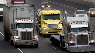 In this Dec. 17, 2010 photo, trucks make their way eastbound, in Livermore, Calif.