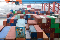 In this March 22, 2019 photo, containers are unloaded by a freighter at the Eurokai terminal (Eurogate) in the port of Hamburg, Germany.