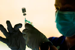 In this Sept. 14, 2021 photo, a syringe is prepared with the Pfizer COVID-19 vaccine at a clinic at the Reading Area Community College in Reading, Pa.