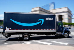 An Amazon truck drives in in Philadelphia, Friday, April 30, 2021. Amazon wants to hire 125,000 delivery and warehouse workers and said Tuesday, Sept. 14, 2021 that it is paying new hires an average of $18 an hour in a tight job market as more people shop online. The company is also offering pay sign-on bonuses of $3,000 in some parts of the country.