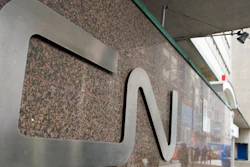 In this May 13, 2021, file photo, a man walks into Central Station next to Canadian National headquarters in Montreal. Canadian National’s $33.6 billion deal to acquire Kansas City Southern railroad is in jeopardy after federal regulators rejected a key part of the plan Tuesday, Aug. 31, 2021 and opened the door for a competing $31 billion offer from Canadian Pacific railroad.
