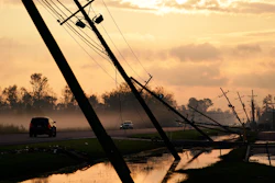 Downed power lines slump over a road in the aftermath of Hurricane Ida, Friday, Sept. 3, 2021, in Reserve, La.