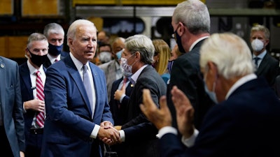 President Joe Biden greets the audience after delivering remarks at the NJ Transit Meadowlands Maintenance Complex, Oct. 25, 2021, Kearny, N.J.