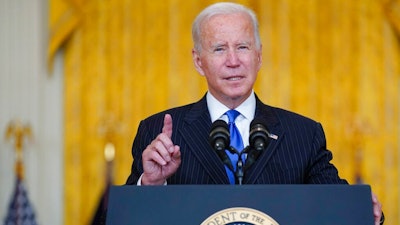 President Joe Biden delivers remarks on efforts to address global supply chain bottlenecks during an event in the East Room of the White House, Wednesday, Oct. 13, 2021, in Washington.