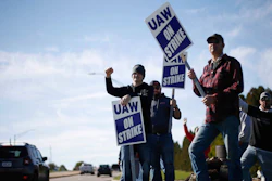 Members of the United Auto Workers strike outside of the John Deere Engine Works plant on Ridgeway Avenue in Waterloo, Iowa, on Friday, Oct. 15, 2021. About 10,000 UAW workers have gone on strike against John Deere since Thursday at plants in Iowa, Illinois and Kansas.