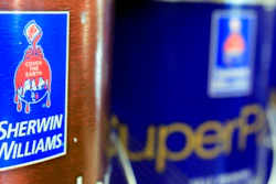 In this Oct. 20, 2010, file photo, cans of paint are seen at a Sherwin Williams store in Brunswick, Maine. Sherwin-Williams is one of a number of companies that have warned higher costs are hurting profits.