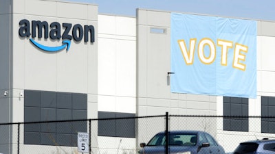 In this March 30 photo, a banner encouraging workers to vote in labor balloting is shown at an Amazon warehouse in Bessemer, Ala.