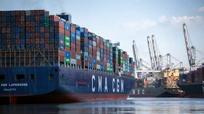 The container ship CMA CGM Laperouse, left, docks at the Georgia Ports Authority's Port of Savannah, Sept. 29, 2021, in Savannah, Ga. The Port of Savannah saw a whopping 20% increase in shipping containers moving across its docks in 2021 as U.S. seaports scrambled to keep up with a surge in cargo that crammed container yards and forced ships to line up and wait at sea. The Georgia Ports Authority reported Tuesday, Jan. 25, 2022 that Savannah's port handled a record 5.6 million container units of imports and exports last year _ an increase of 1 million container units from the 2020 calendar year.