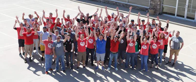 The staff of Weisser Distributing outside its location in Tea, SD.