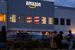 People arrive for work at the Amazon distribution center in the Staten Island borough of New York on Oct. 25, 2021.