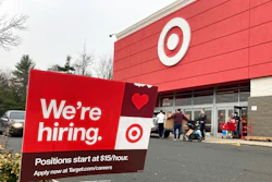 A hiring sign is in front of a Target store in Manchester, Conn., Nov. 39, 2021. Workers at Target stores and distribution centers in places like New York, where competition for finding and hiring staff is the fiercest, could see starting wages as high as $24 an hour this year. The Minneapolis-based discount retailer said Monday, Feb. 28, 2022 that it will adopt minimum wages that range from $15 to $24 an hour, with the highest pay going to hires in the most competitive markets. It currently pays a universal starting wage of $15 an hour.
