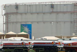 Fuel trucks line up in front of storage tanks at the North Jiddah bulk plant, an Aramco oil facility, in Jiddah, Saudi Arabia, on March 21, 2021.