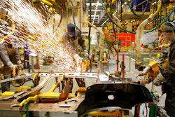 Workers of Renault's Moscow plant prepare car parts for the production line, on March 1, 2010. French automaker Renault moved to pause production at its Moscow plant in an apparent move to fend off mounting criticism, breaking ranks with other major French companies that have defied pressure to keep operating in Russia.