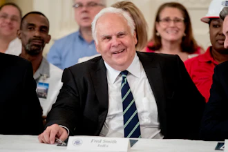 FedEx CEO Fred Smith appears at a signing ceremony in the East Room of the White House, July 19, 2018.