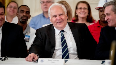 FedEx CEO Fred Smith appears at a signing ceremony in the East Room of the White House, July 19, 2018.