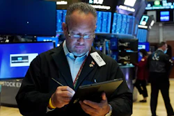 Trader Robert Arciero works on the floor of the New York Stock Exchange, Aug. 10, 2021.