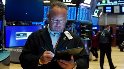 Trader Robert Arciero works on the floor of the New York Stock Exchange, Aug. 10, 2021.