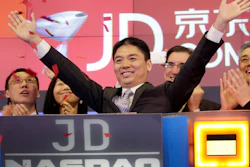 Liu Qiangdong, also known as Richard Liu, CEO of JD.com, raises his arms to celebrate the IPO for his company at the Nasdaq MarketSite, New York, May 22, 2014.