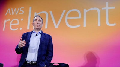 In this Dec. 5, 2019, file photo, AWS CEO Andy Jassy, discusses a new initiative with the NFL during AWS re:Invent 2019 in Las Vegas. In his first letter to Amazon shareholders, Jassy offered a defense of wages and benefits the company gives its warehouse workers while also vowing to improve injury rates inside the facilities. Jassy, who took over from Amazon founder Jeff Bezos as CEO last July, wrote the company has researched and created a list of the top 100 “employee experience pain points” and is working to solve them. A report released this week by a coalition of four labor unions found Amazon employed 33% of all U.S. warehouse workers in 2021, but was responsible for 49% of all injuries in the industry.