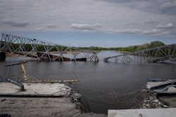A destroyed railway bridge over the Siverskiy Donets river near Raigorodka, Ukraine, April 30, 2022.