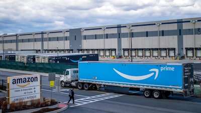 A truck arrives at the Amazon warehouse facility on the Staten Island borough of New York, April 1, 2022. Amazon is planning to sublease some of its warehouse space because the pandemic-fueled surge in online shopping has slowed.