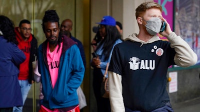 Members and supporters of the Amazon Labor Union stand outside an office of the National Labor Relations Board after a count of votes for unionization was concluded in New York, Monday, May 2, 2022.