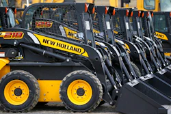 In this photo made on Friday, March 28, 2014, earth moving and construction equipment by New Holland, a CNH Industrial brand, is stored on a lot at the Highway Equipment Company in Zelienople, Pa. More than 1,000 workers at CNH Industrial plants in Wisconsin and Iowa went on strike Monday, May 2, 2022, in search of a better deal with the company that makes agriculture and construction equipment.