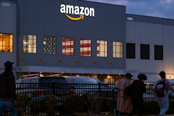 People arrive for work at the Amazon distribution center, Staten Island, New York, Oct. 25, 2021.