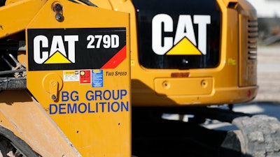 A Caterpillar 279D Compact Track Loader, left, and 308E2 CR Mini Hydraulic Excavator at a demolition site in Fort Lauderdale, Fla., May 8, 2019.