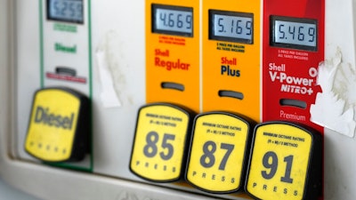 Prices per gallon are displayed over labels of various grades of gasoline at a Shell station Thursday, June 9, 2022, in Littleton, Colo.