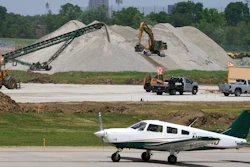 A small plane taxis past construction at the Des Moines International Airport, Des Moines, Iowa, June 13, 2022.