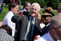 Sen. John Cornyn, R-Texas, takes a selfie as he arrives to an event to celebrate the passage of the 'Bipartisan Safer Communities Act,' a law meant to reduce gun violence, on the South Lawn of the White House, Monday, July 11, 2022, in Washington.