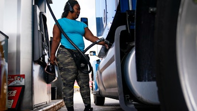 Delores Bledsoe of Houston, Texas, fuels up her rig at a truck stop in Carlisle, Pa., July 13, 2022.