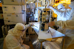 Technicians inspect a piece of equipment during a tour of the Micron Technology automotive chip manufacturing plant Feb. 11, 2022, in Manassas, Va. A bill to boost semiconductor productionin the United States is making its way through the Senateis atop priority of the Biden administration. It would add about $79 billion to the deficit over 10 years, mostly as a result of new grants and tax breaks that would subsidize the cost that computer chip manufacturers incur when building or expanding chip plants in the U.S.