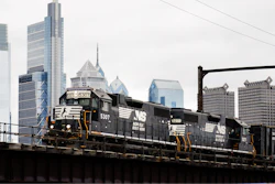A Norfolk Southern freight train moves along elevated tracks in Philadelphia, Oct. 27, 2021.