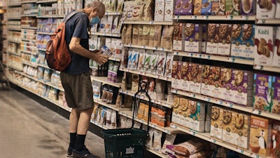 A man shops at a supermarket, July 27, 2022, New York.