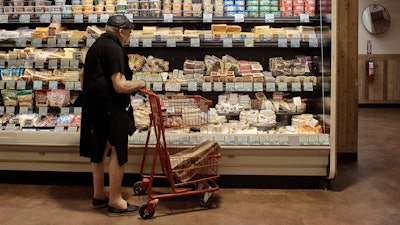 A man shops at a supermarket in New York, July 27, 2022.