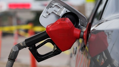 A motorist fills up the tank on a sedan, Saratoga, Wyo., July 22, 2022.