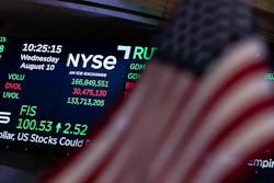 A screen displays market data at the New York Stock Exchange, Aug. 10, 2022.