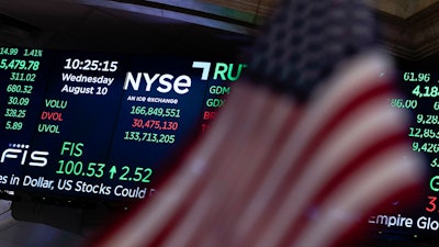 A screen displays market data at the New York Stock Exchange, Aug. 10, 2022.